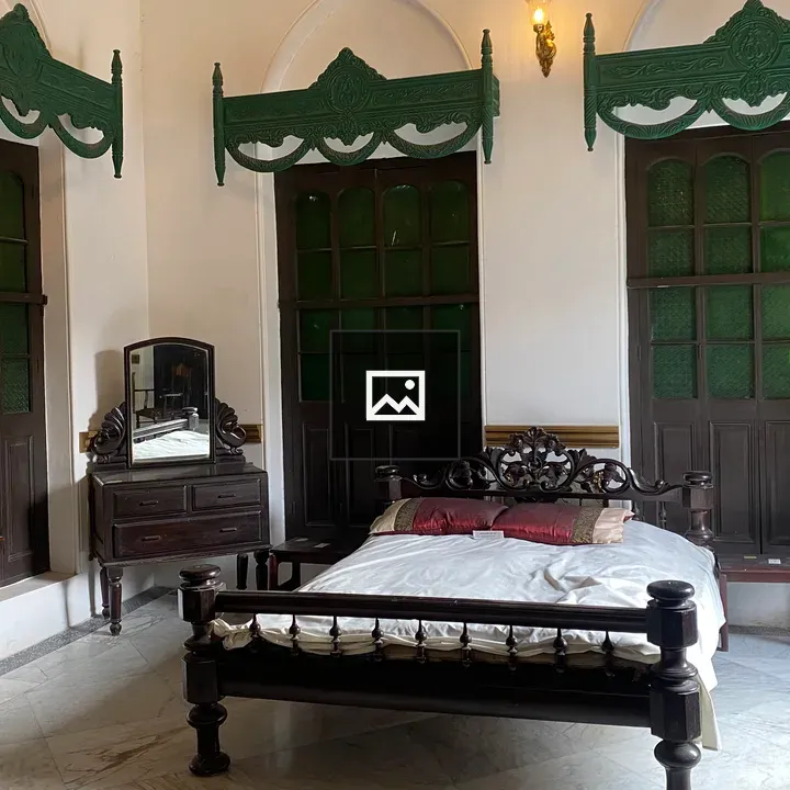 Bedroom with wooden bed and headboard