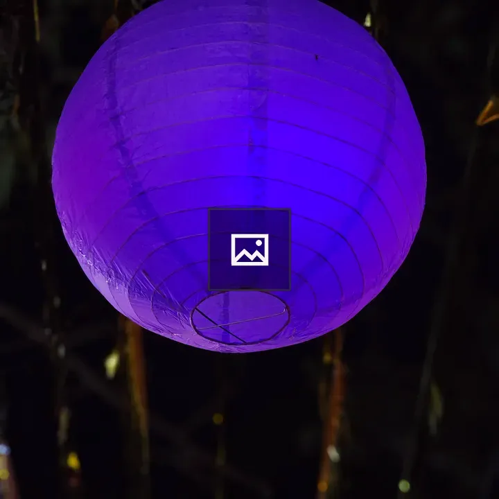 Glowing purple lantern at night