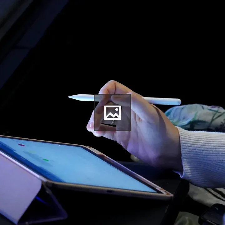 Person with stylus and tablet