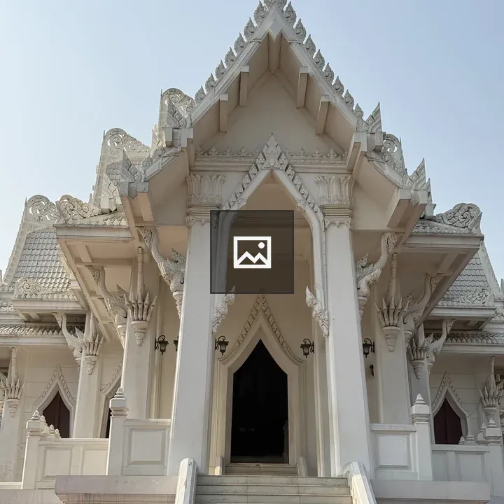White temple structure with ornate gables