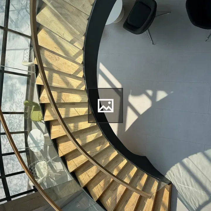 Aerial spiral staircase with glass railing