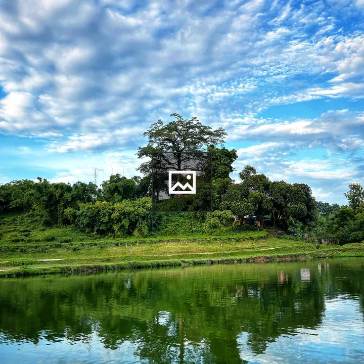 Tranquil lake landscape with hill