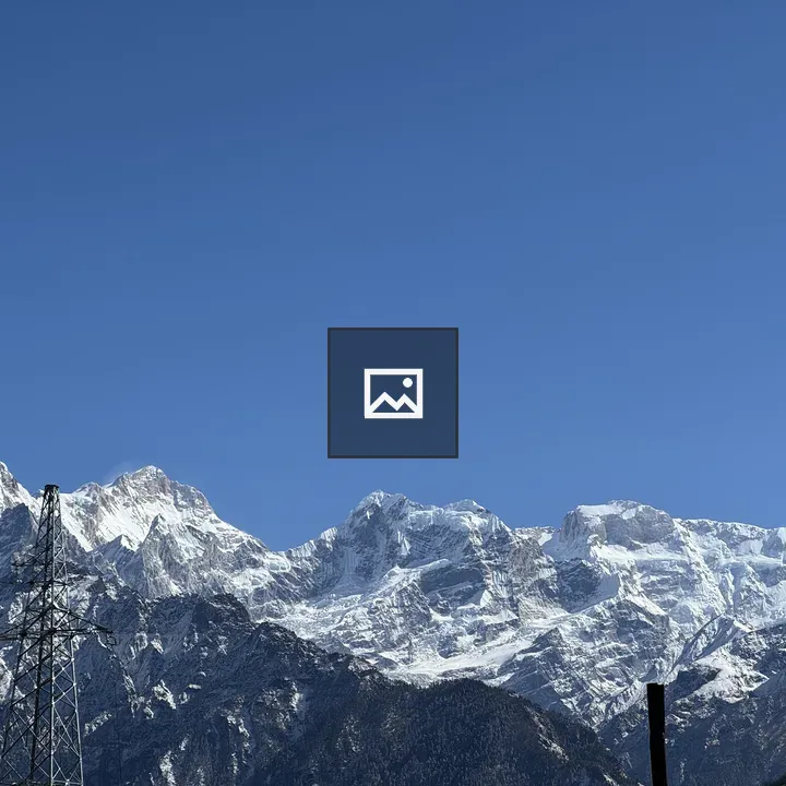 Snow-capped mountains with pylon