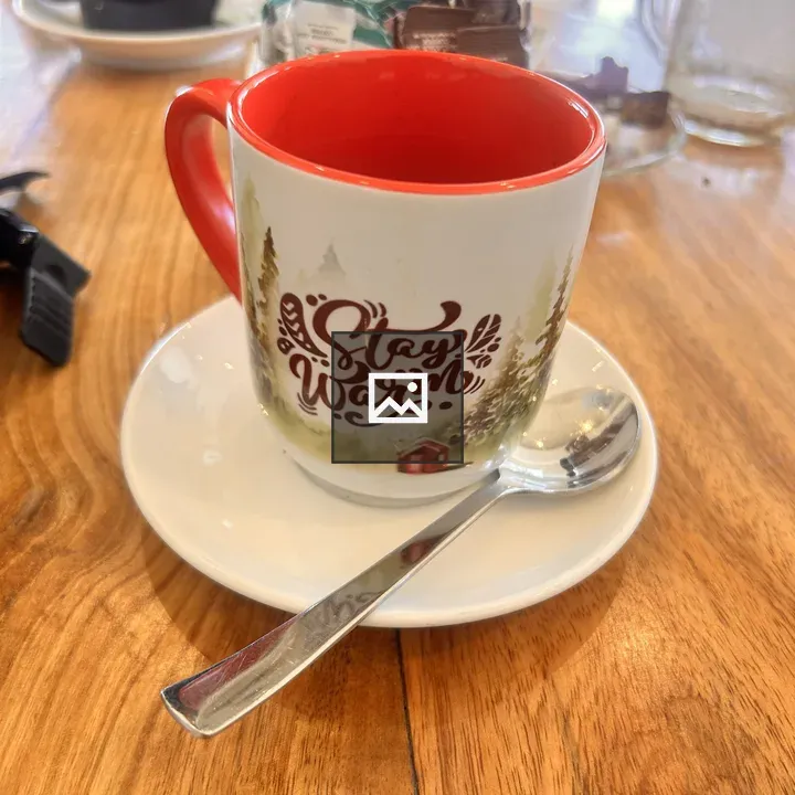 White mug with Stay Warm design