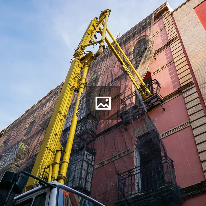 Huge concrete pump with yellow arm