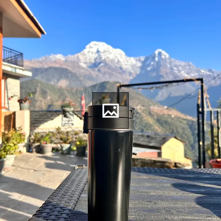Coffee Cup Against Annapurna Backdrop