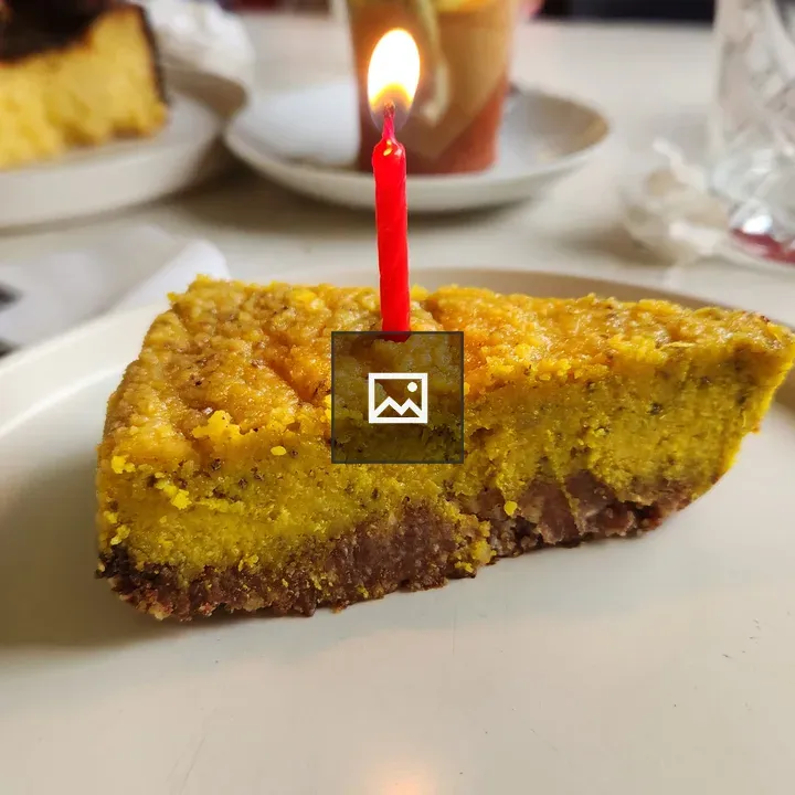 Slice of cake with candle