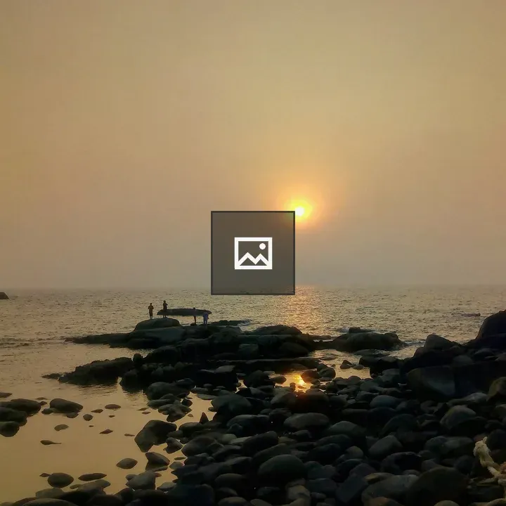 Sunset on rocky beach