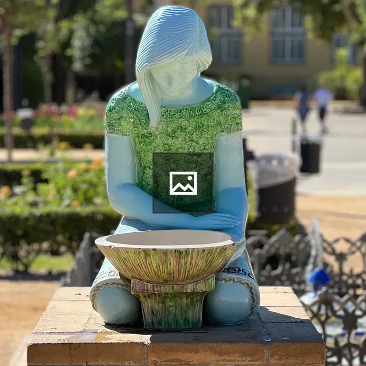 Sunlit water fountain sculpture