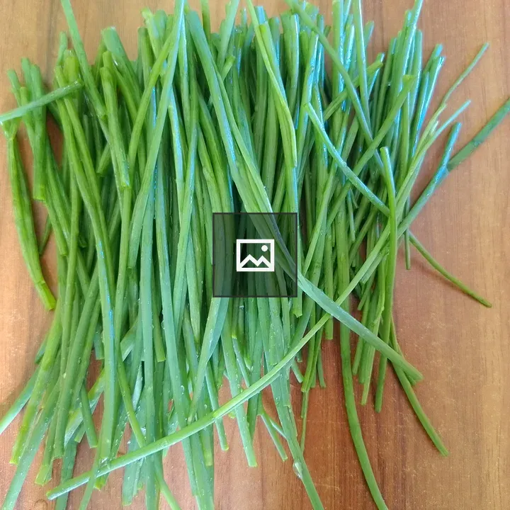 Green Onion Leaves on Wood