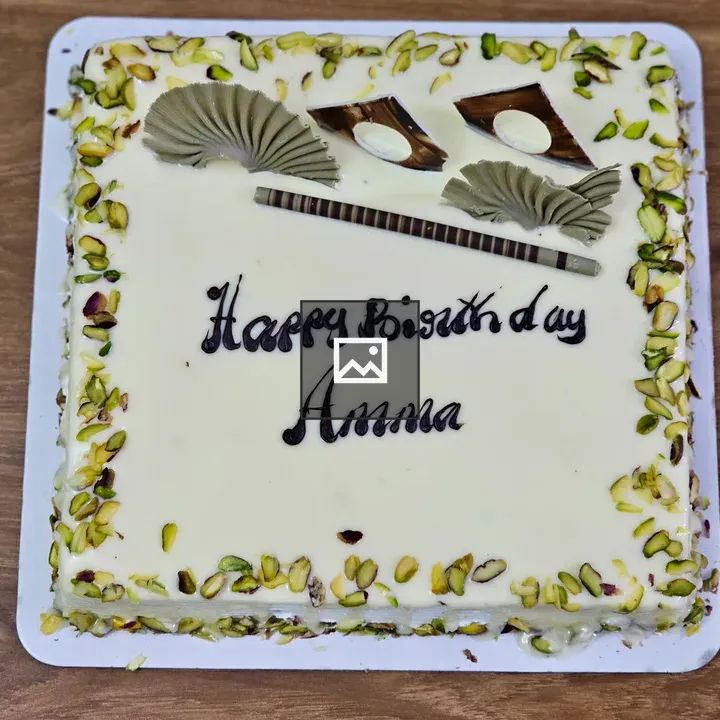 Birthday cake with white cream and pistachio