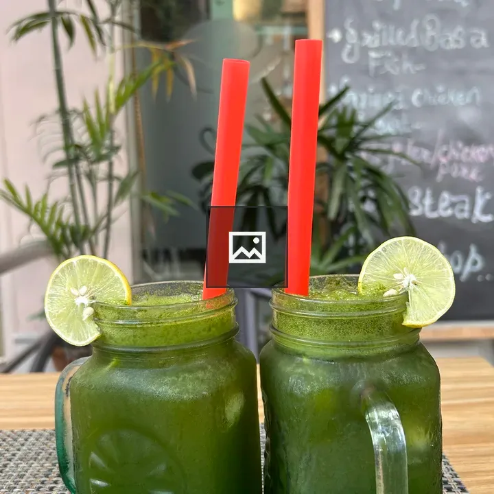 Two mason jar drinks with lime