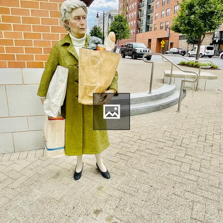 The Holding Out statue by Seward Johnson