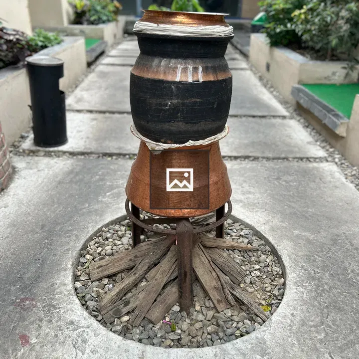 Traditional tandoor setup with pots