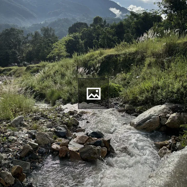 Flowing Stream Through Rocky Landscape