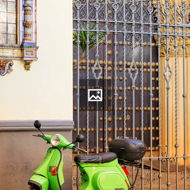 Green scooter in front of church