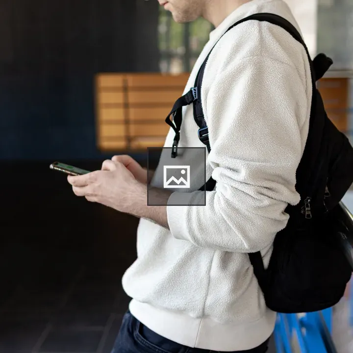Man with Phone by Chrome Railing
