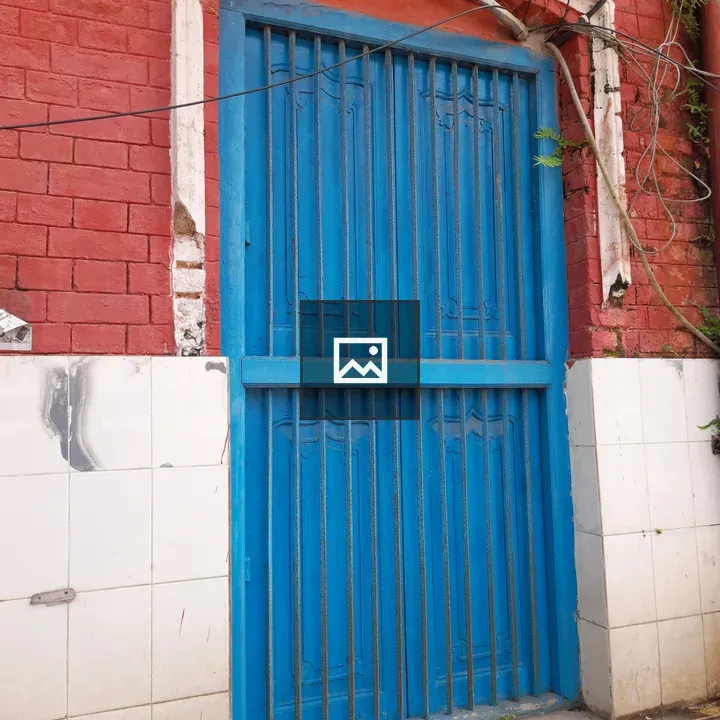Blue door on red brick wall