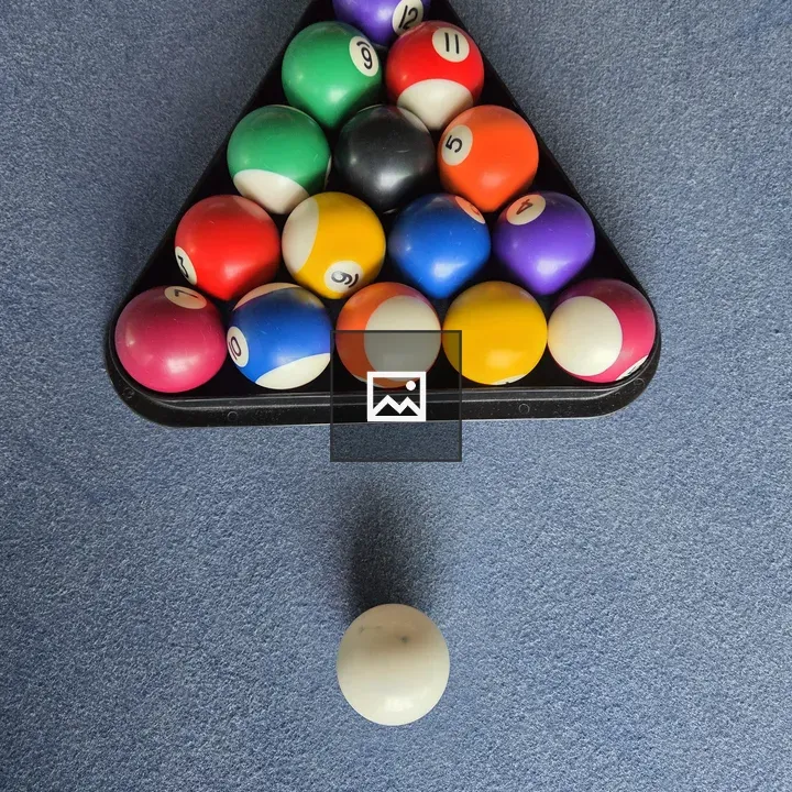 Triangular billiard rack on pool table