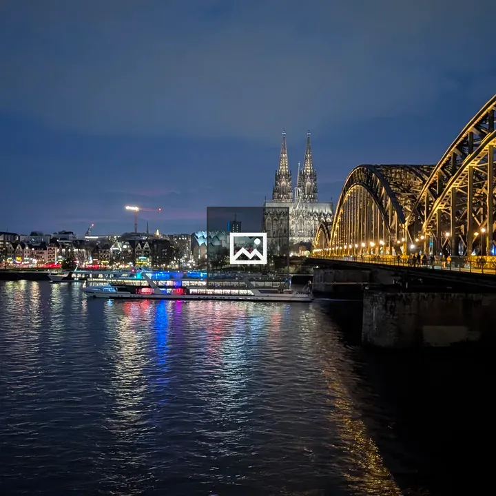 Cityscape at Night with River Reflections