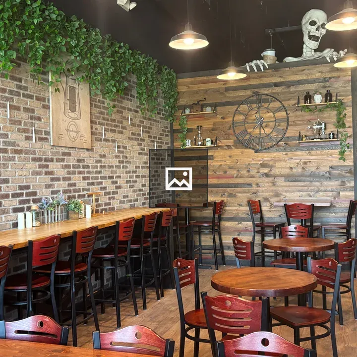 Coffee shop seating with skeleton mural