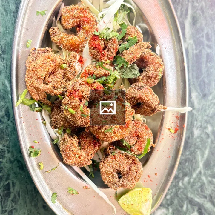 Fried shrimp on silver platter