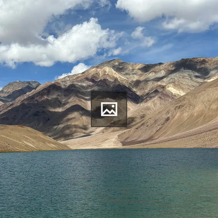 Clear blue lake with mountains