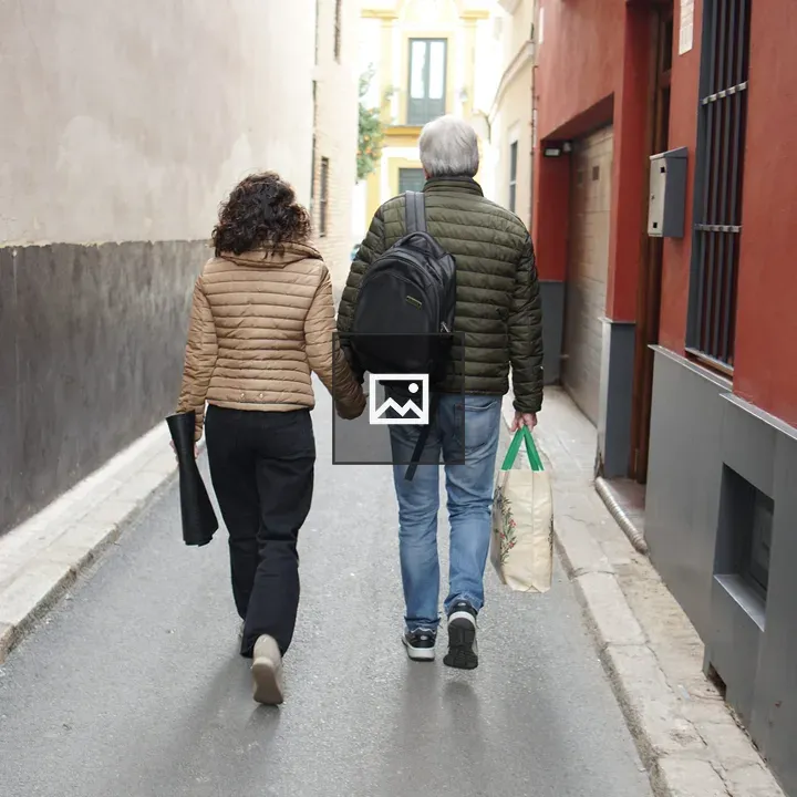 Couple Walking on Narrow Street