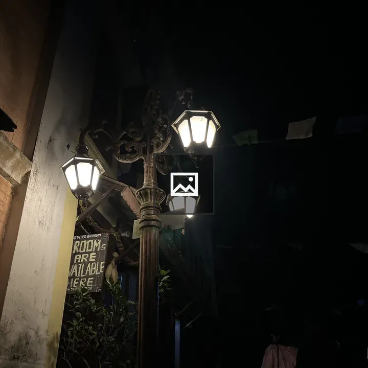 Three street lamps on lamppost