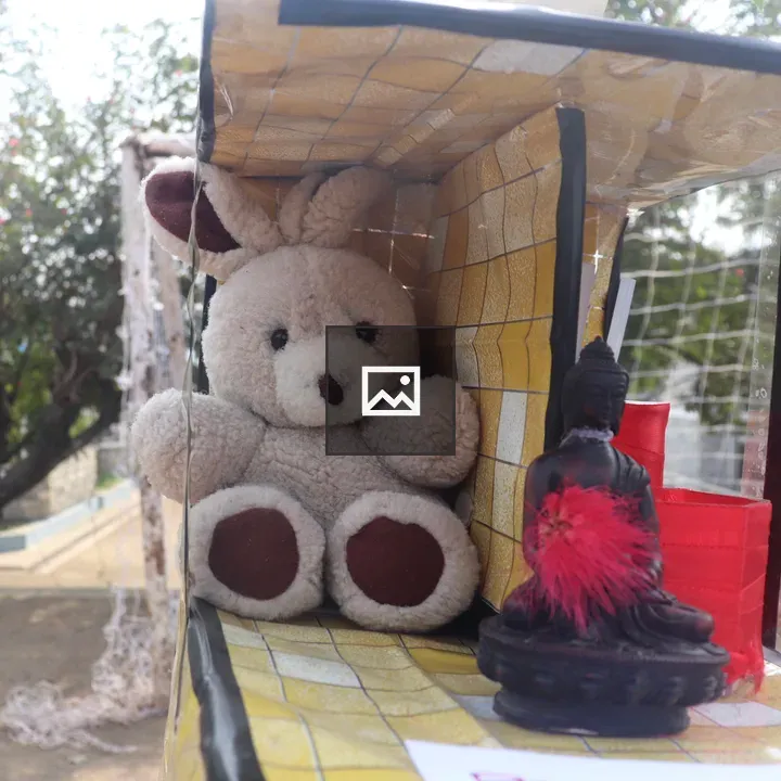 Plush Bunny and Buddha Figurine
