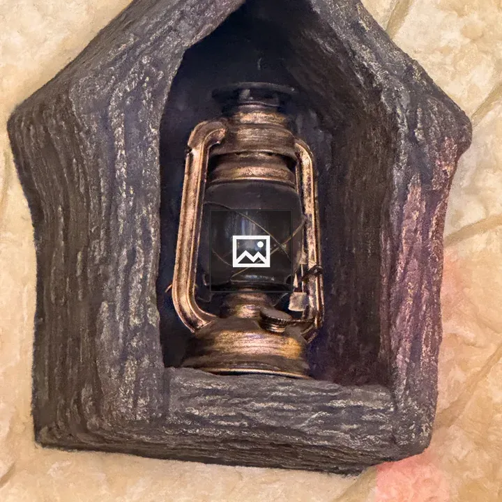 Vintage lantern in wooden frame
