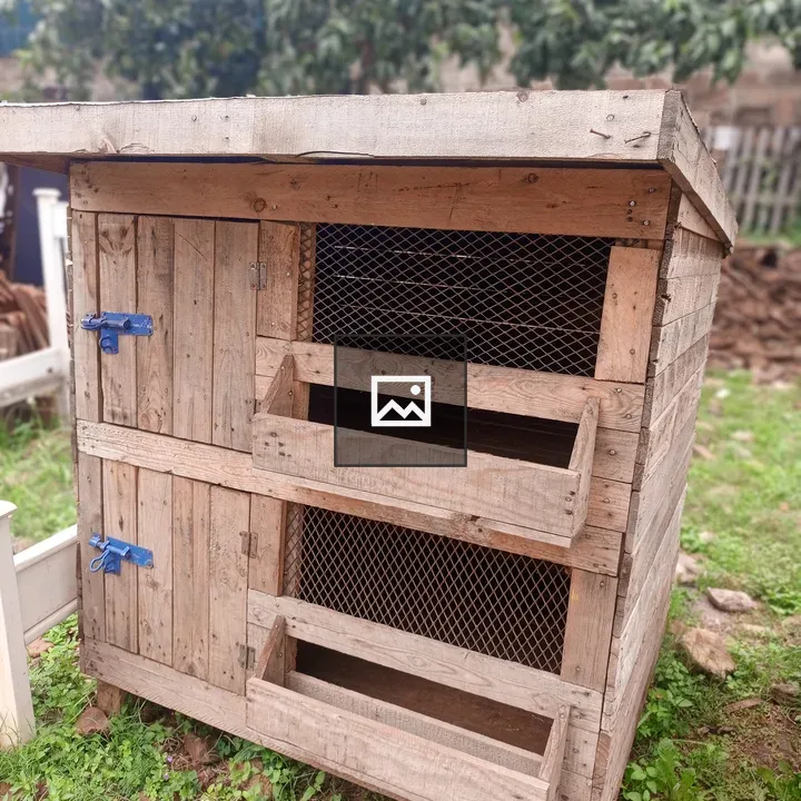 Wooden dog cage on grass