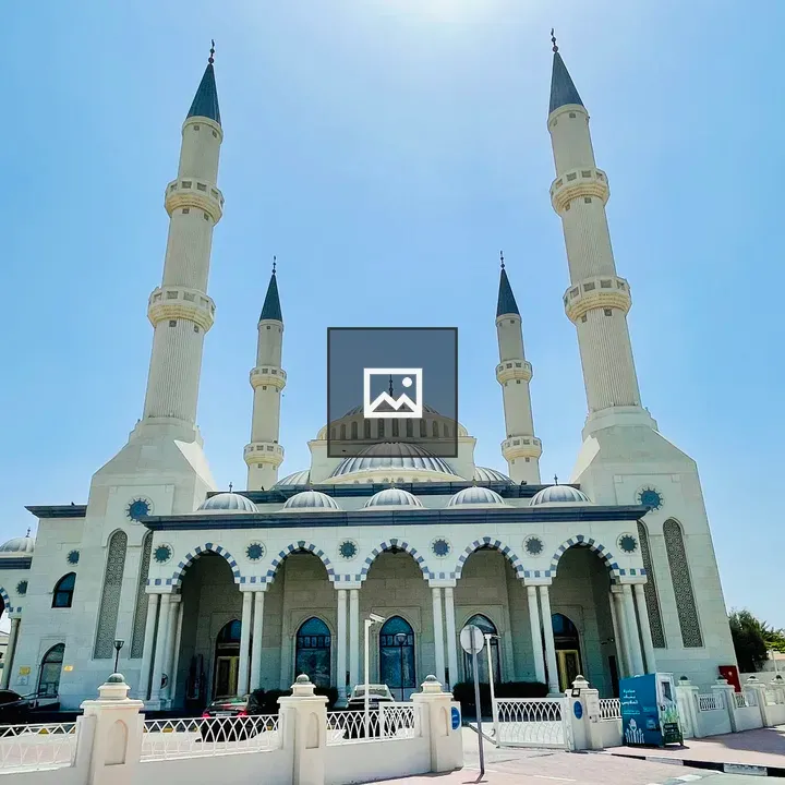 White mosque with domes and minarets