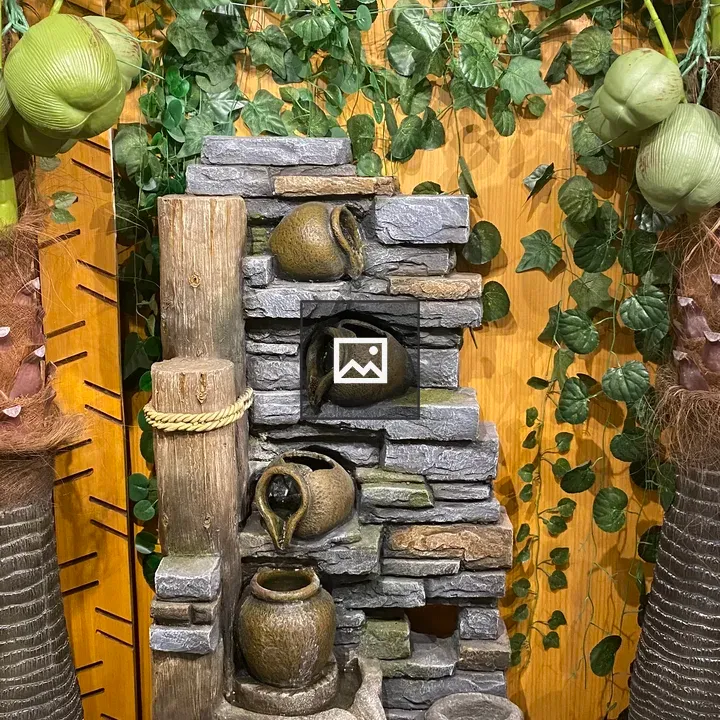 Decorative fountain with ceramic jugs