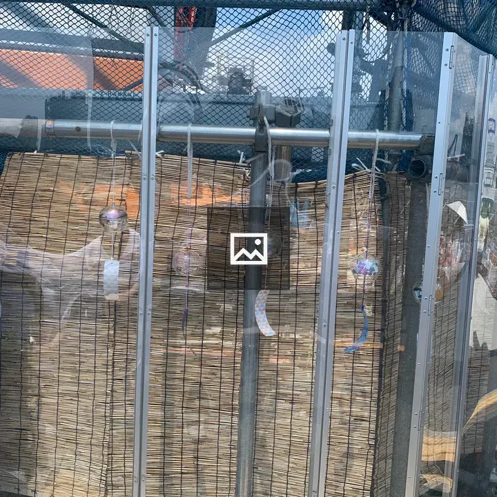 Glass wind chimes at a construction site