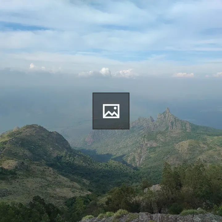 Mountain Valley with Cloudy Sky