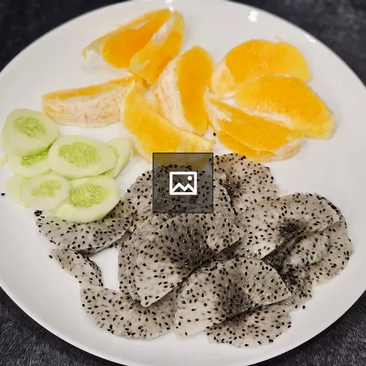 Oranges and Dragon Fruit on Plate
