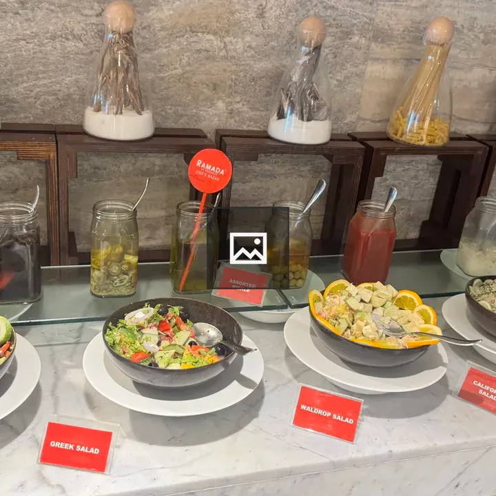 Salads and condiments on marble