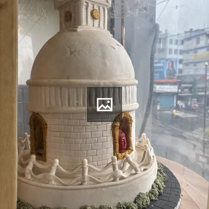 Decorative white iced cake dome