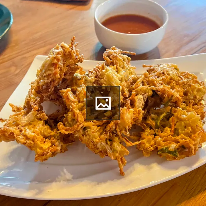 Three pakora fritters on plate