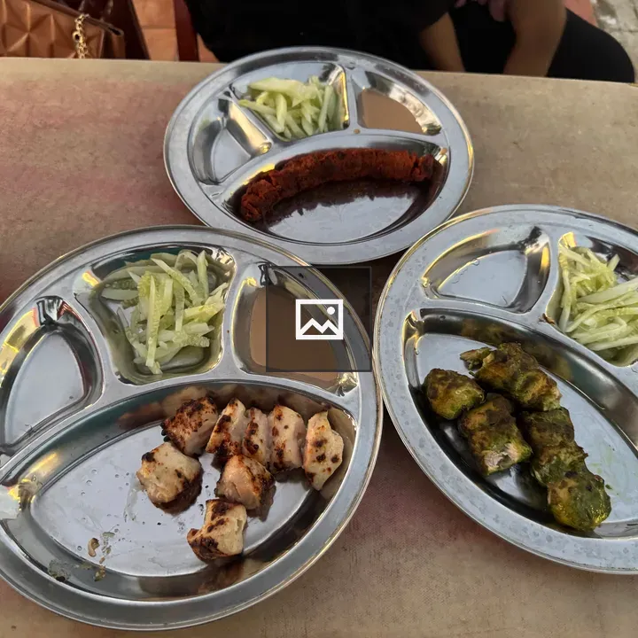 Three plates of grilled chicken