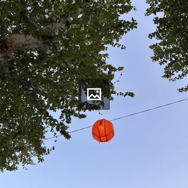 Orange lantern in blue sky