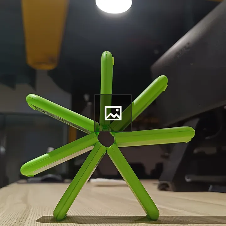 Green fan structure made of candy packs