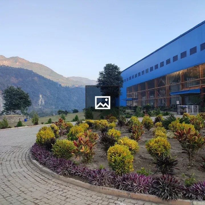 Industrial Building with Garden and Hills