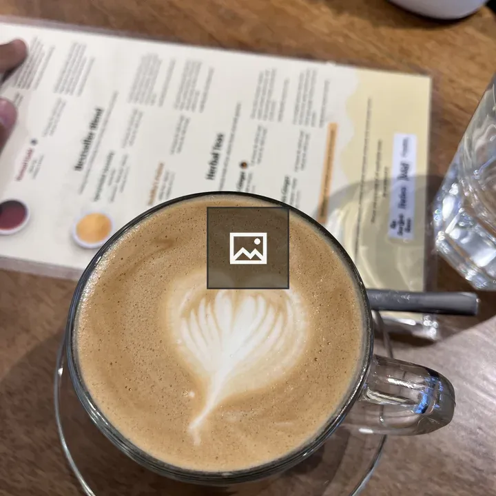 Top of a Coffee Cup with Foam Heart