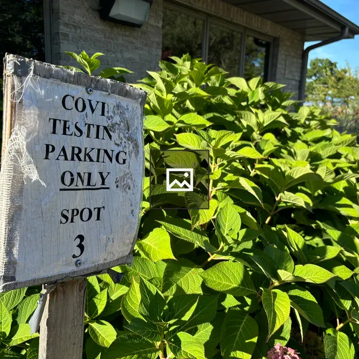 Beat Up Sign Outside Doctor’s Office