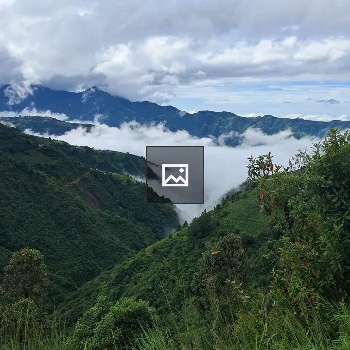 Lush green hill and mountain vista