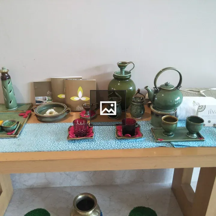 Green ceramic tea set on table