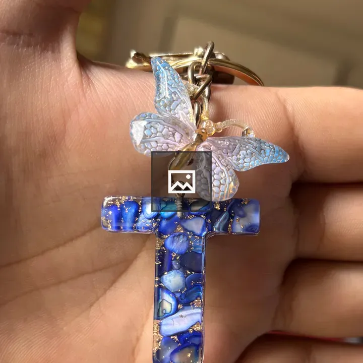 Hand holding decorative keychain