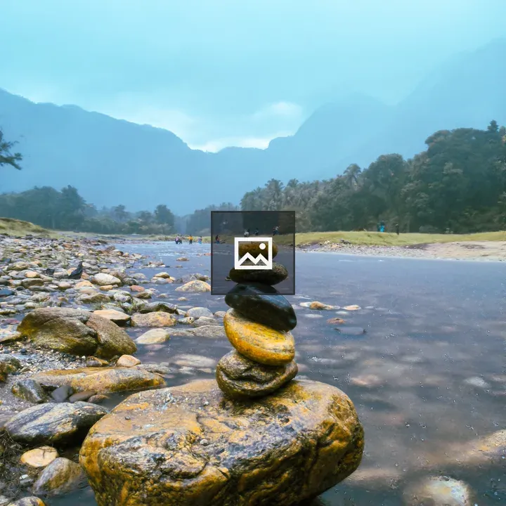 Stacked stones on river shore
